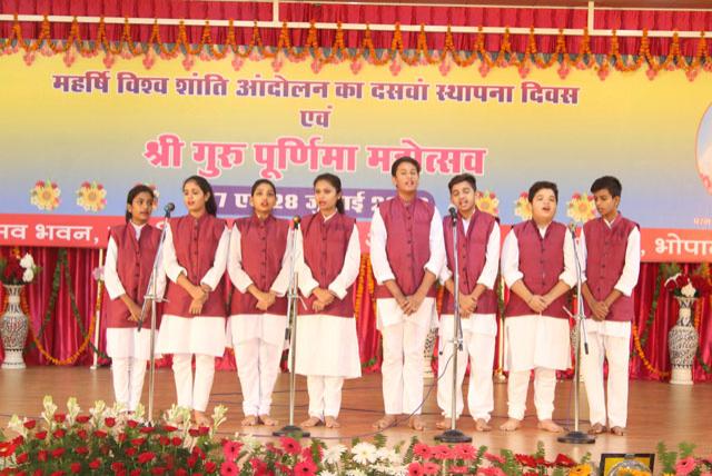 Students of Maharishi Vidya Mandir Jabalpur singing song during Guru Purnima Celebration.