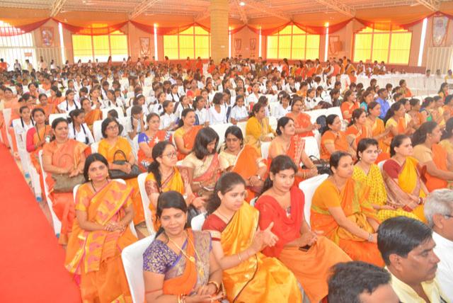 Audience in hall at the left side.